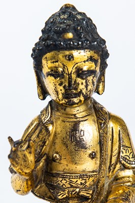 Lot 68 - Cast gilt-bronze figure of Buddha Shakyamuni