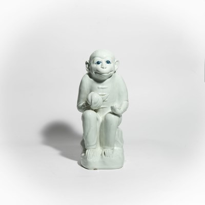 Lot 53 - A Japanese Hirado white glazed porcelain seated Monkey