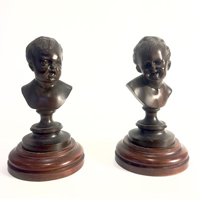 Lot 23 - Pair of Children’s Busts: "The Crying Boy" and "The Laughing Boy"After François DUQUESNOY )