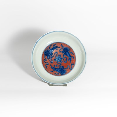 Lot 75 - A Chinese Blue and White and Iron-Red ‘Shishi’ Dish